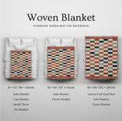 Woven blanket with size chart on a gray background