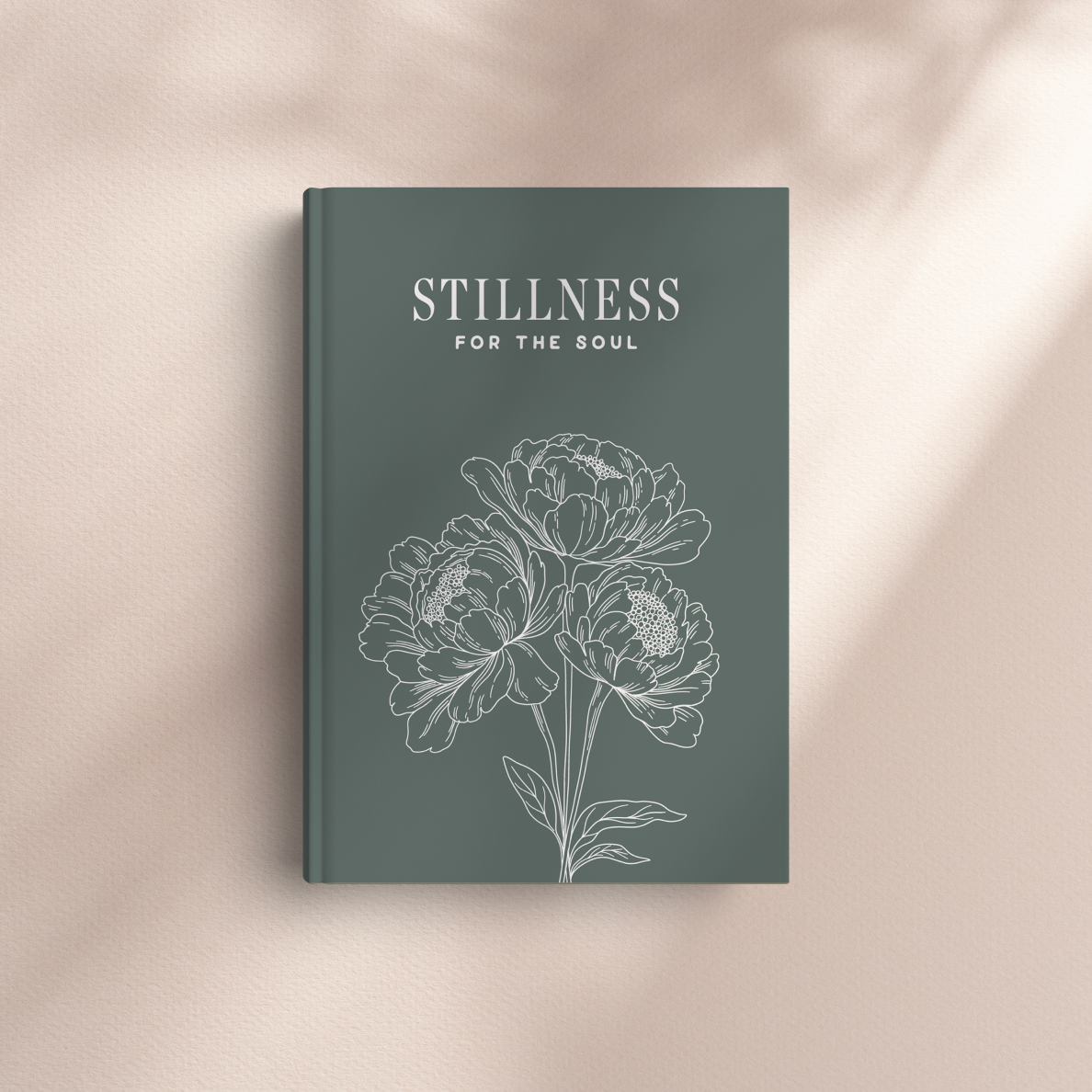 Book titled 'Stillness for the Soul' with floral design on a beige background