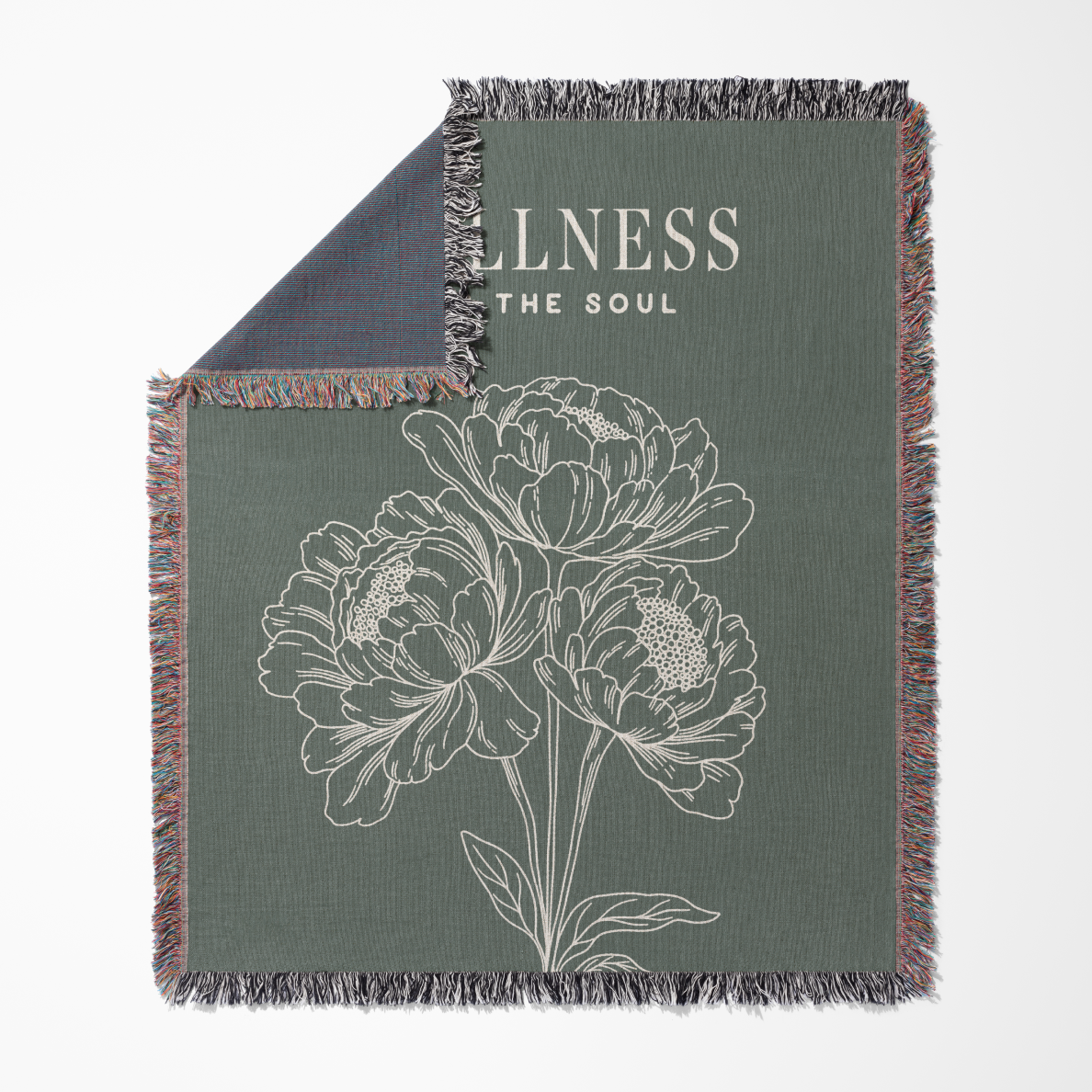 Green blanket with floral design and 'Wellness The Soul' text on a white background