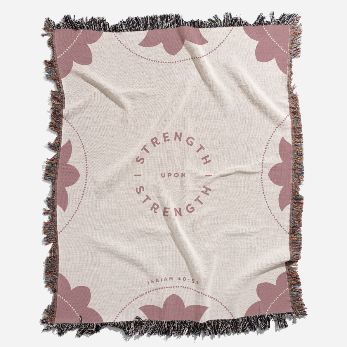 Blanket with 'Strength Upon Strength' text and butterfly designs on a beige background