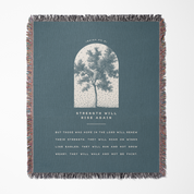 Blanket with tree design and text on a blue background