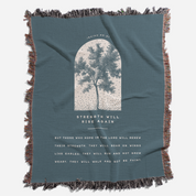 Blue blanket with tree design and text on a white background