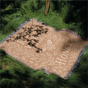 Warm-toned woven blanket with the phrase “Kind words are like honey,” floral accents, and a honey bee; 100% cotton with fringe, perfect for Christian gifting and home decor.