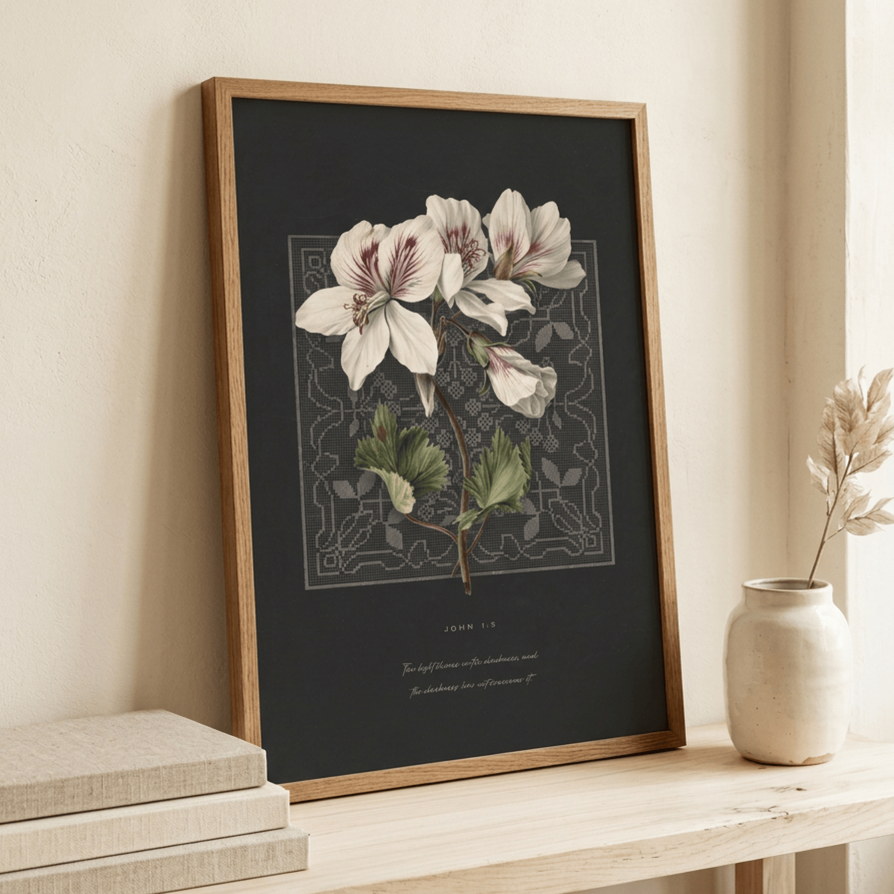 John 1:5 wall art framed in wood, styled on a console with a vase and books — christian scripture wall decor in a home