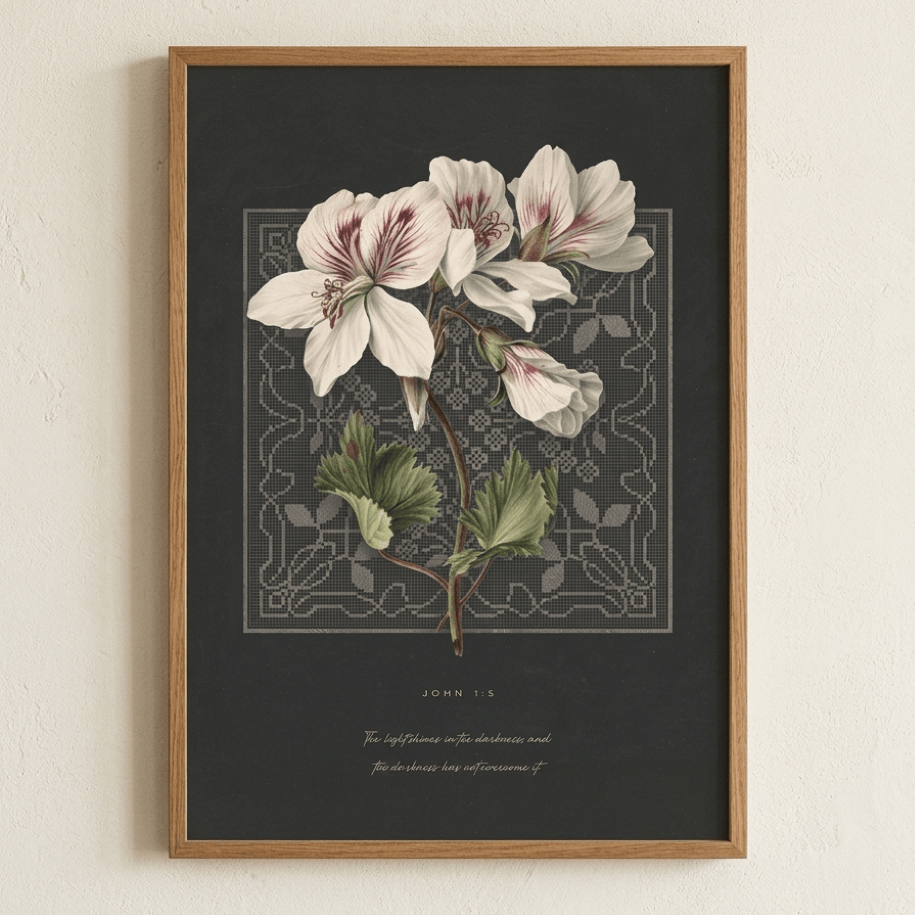 John 1:5 print in a thin wood frame on a plaster wall — minimalist christian scripture wall art