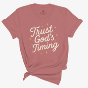 Christian t-shirt with “Trust God’s Timing” in shining script design; unisex soft cotton shirt symbolizing faith, patience, and hope in God's perfect plan.