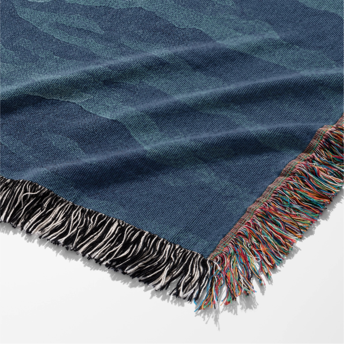 Woven Christian blanket depicting Jesus walking on water, made of 100% cotton with colorful fringe; perfect for home decor, prayer spaces, or faith-based gifts.