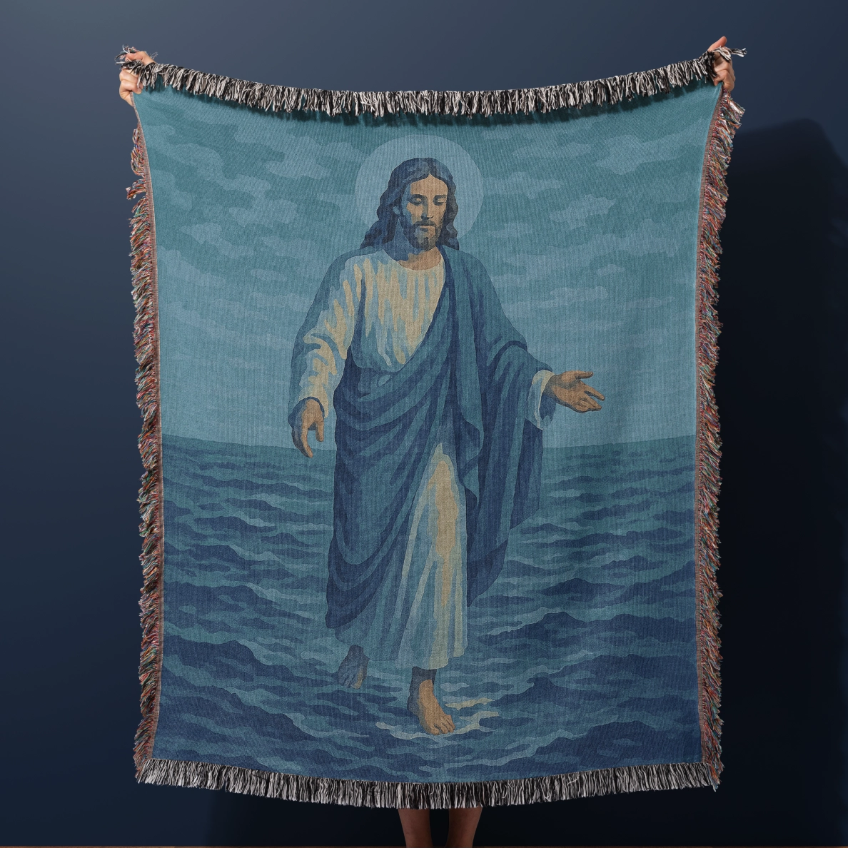 Woven Christian blanket depicting Jesus walking on water, made of 100% cotton with colorful fringe; perfect for home decor, prayer spaces, or faith-based gifts.