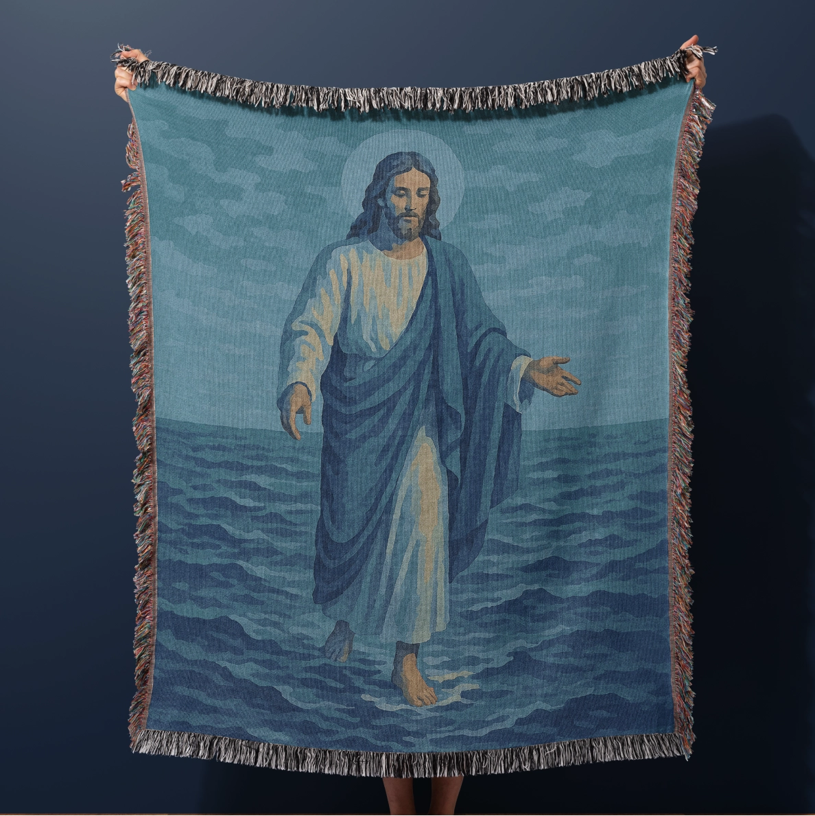 Woven Christian blanket depicting Jesus walking on water, made of 100% cotton with colorful fringe; perfect for home decor, prayer spaces, or faith-based gifts.