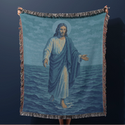 Woven Christian blanket depicting Jesus walking on water, made of 100% cotton with colorful fringe; perfect for home decor, prayer spaces, or faith-based gifts.