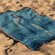 Woven Christian blanket depicting Jesus walking on water, made of 100% cotton with colorful fringe; perfect for home decor, prayer spaces, or faith-based gifts.