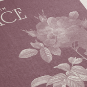 Floral design on a textured fabric with text overlay